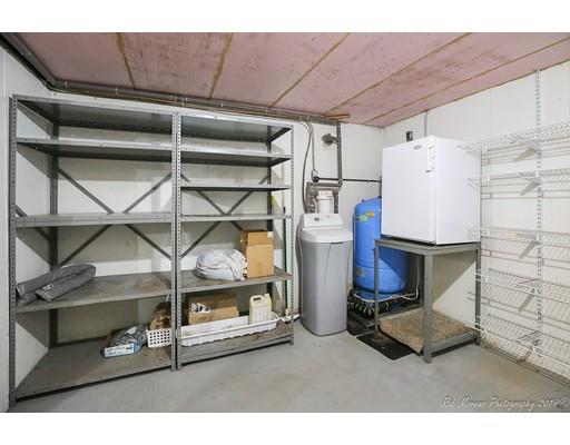 29 Spring Hill Road Newbury, MA 01922 - Photo 28 of 32 a room with wooden cabinets and outdoor seating