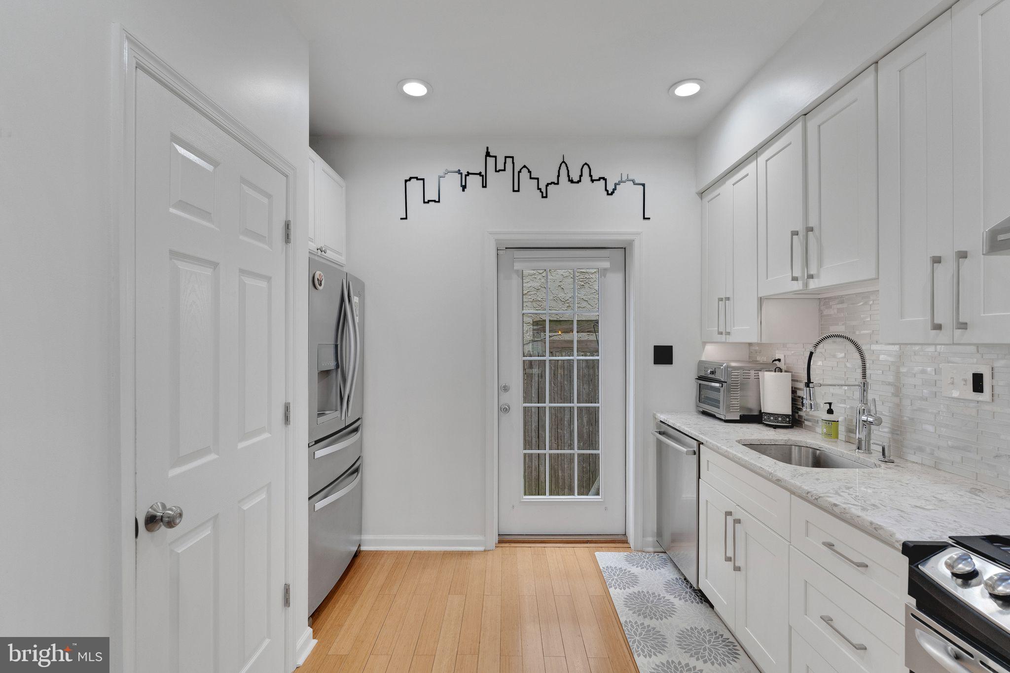 a view of a kitchen with electric appliances