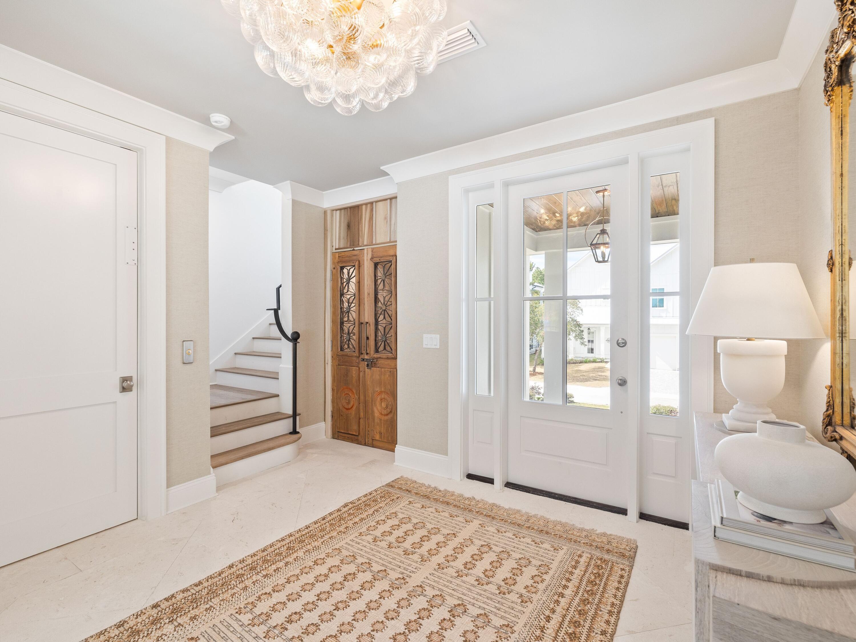 41 Marthas Lane Santa Rosa Beach, FL 32459 - Photo 27 of 101 a view of a hallway with bathroom and wooden floor