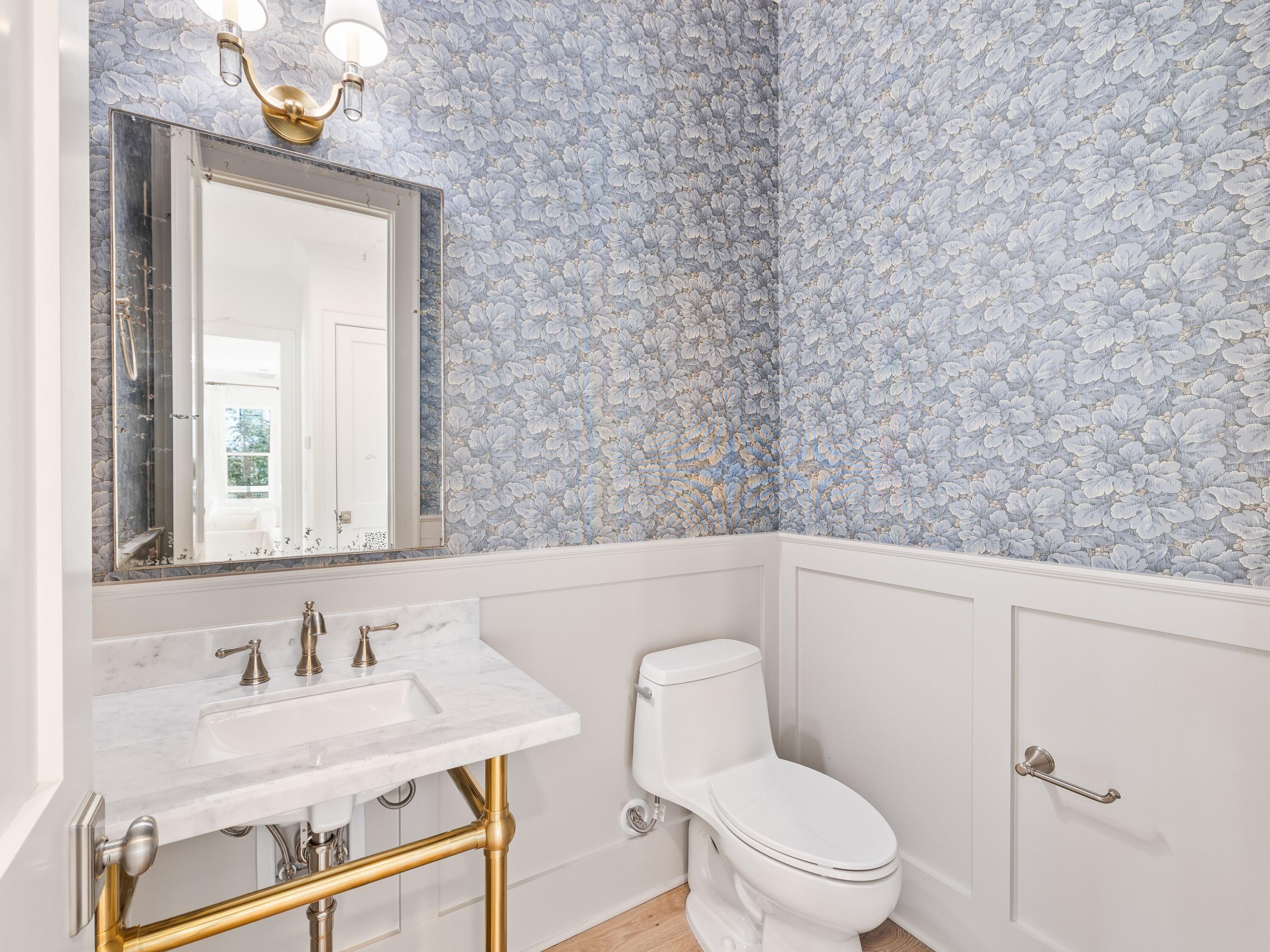 41 Marthas Lane Santa Rosa Beach, FL 32459 - Photo 65 of 101 a bathroom with a granite countertop sink vanity mirror and toilet