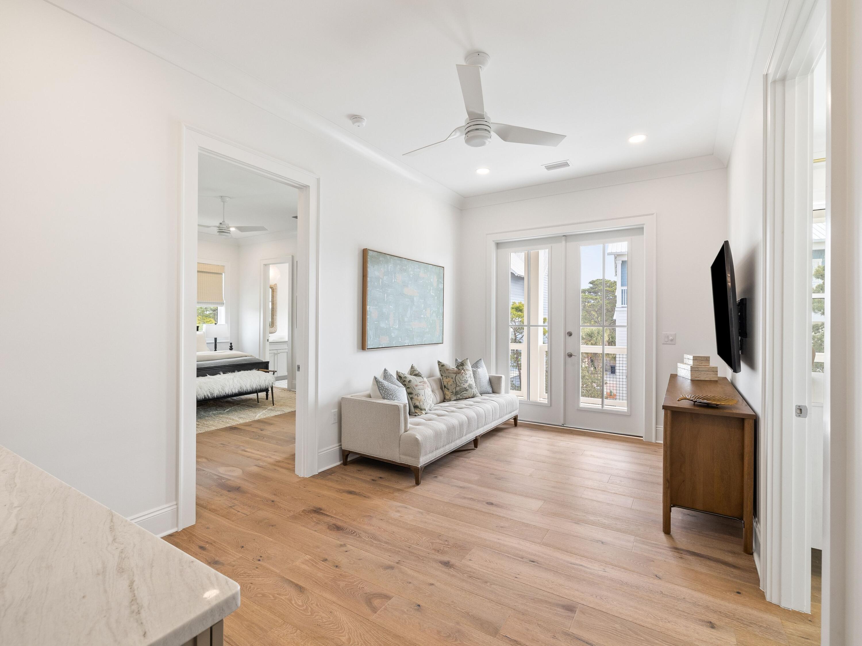 41 Marthas Lane Santa Rosa Beach, FL 32459 - Photo 77 of 101 a living room with furniture and a flat screen tv