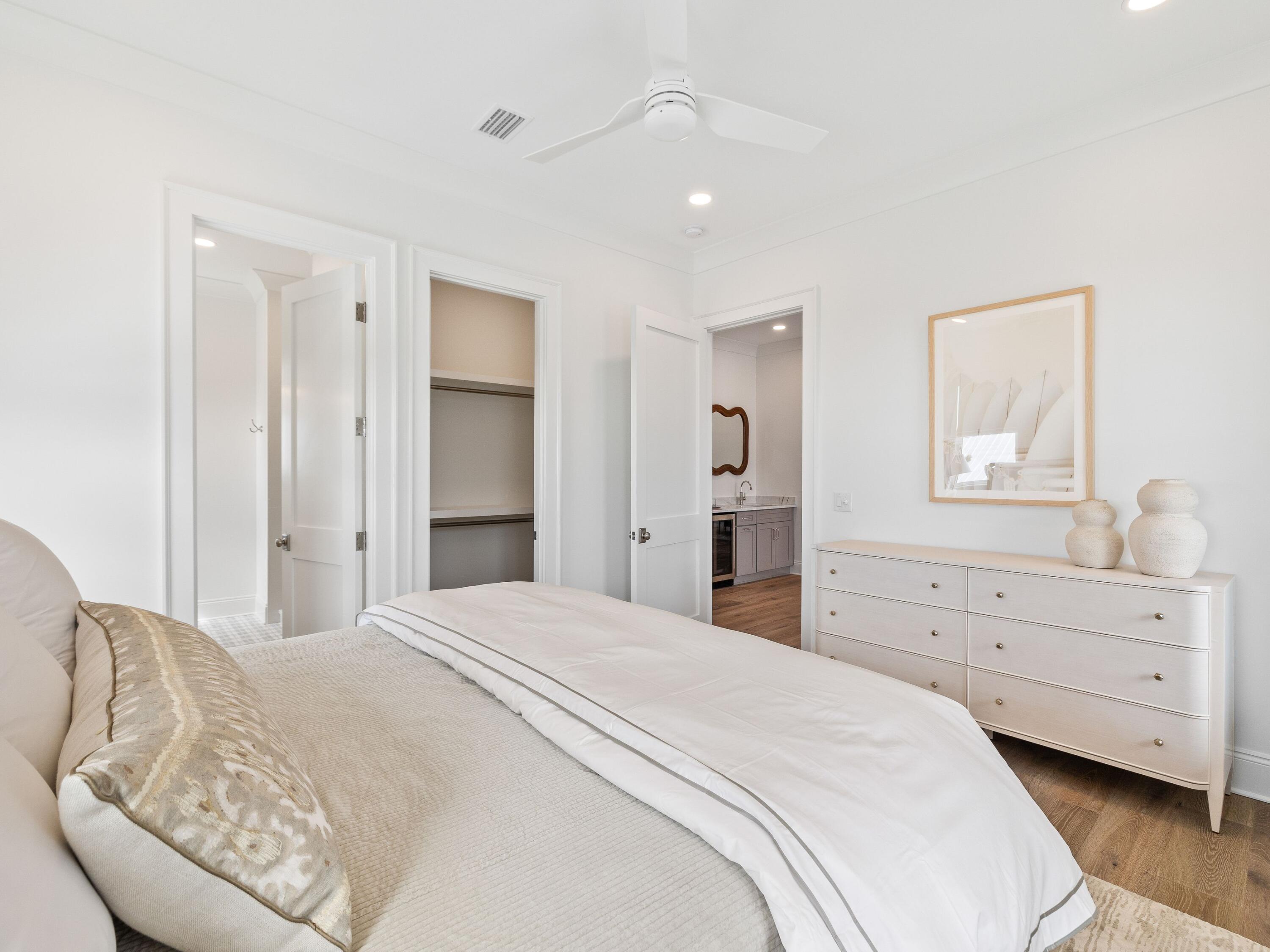 41 Marthas Lane Santa Rosa Beach, FL 32459 - Photo 81 of 101 a spacious bedroom with a bed and a dresser