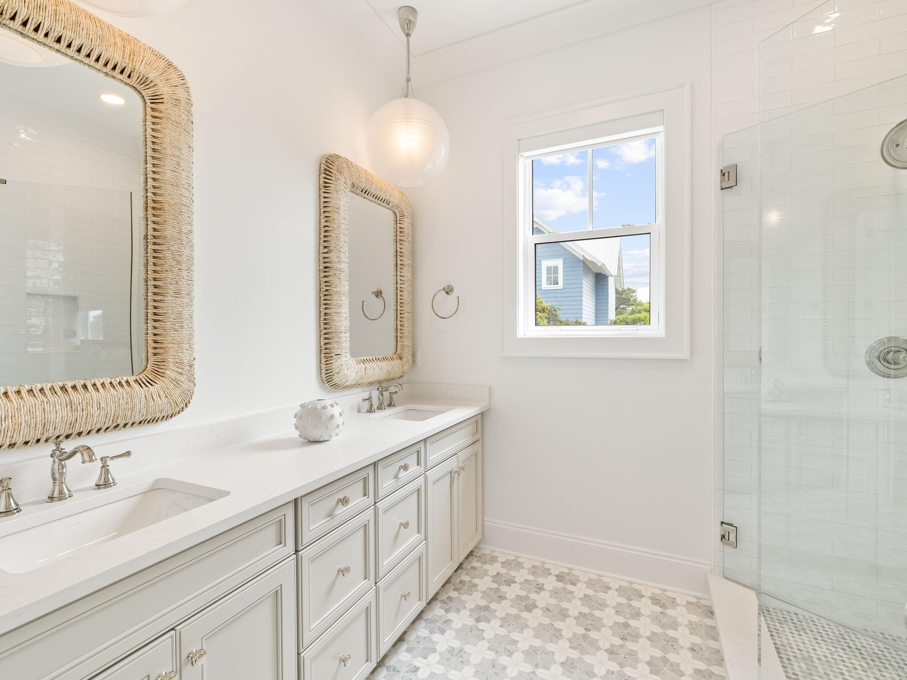 41 Marthas Lane Santa Rosa Beach, FL 32459 - Photo 87 of 101 a bathroom with double vanity sink a mirror and a shower