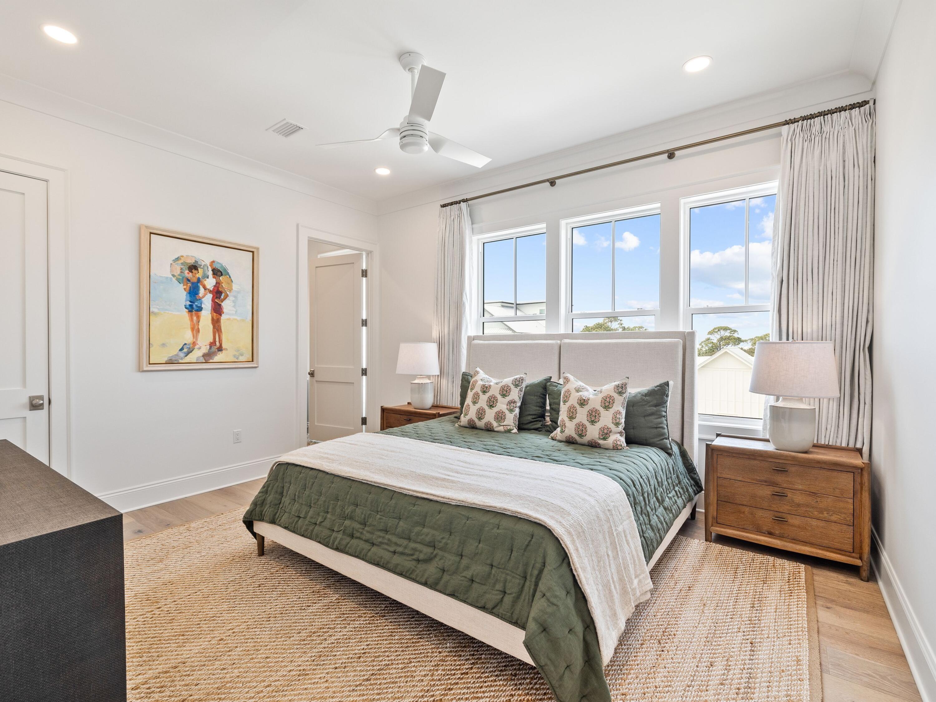 41 Marthas Lane Santa Rosa Beach, FL 32459 - Photo 93 of 101 a bedroom with a large bed and a chandelier