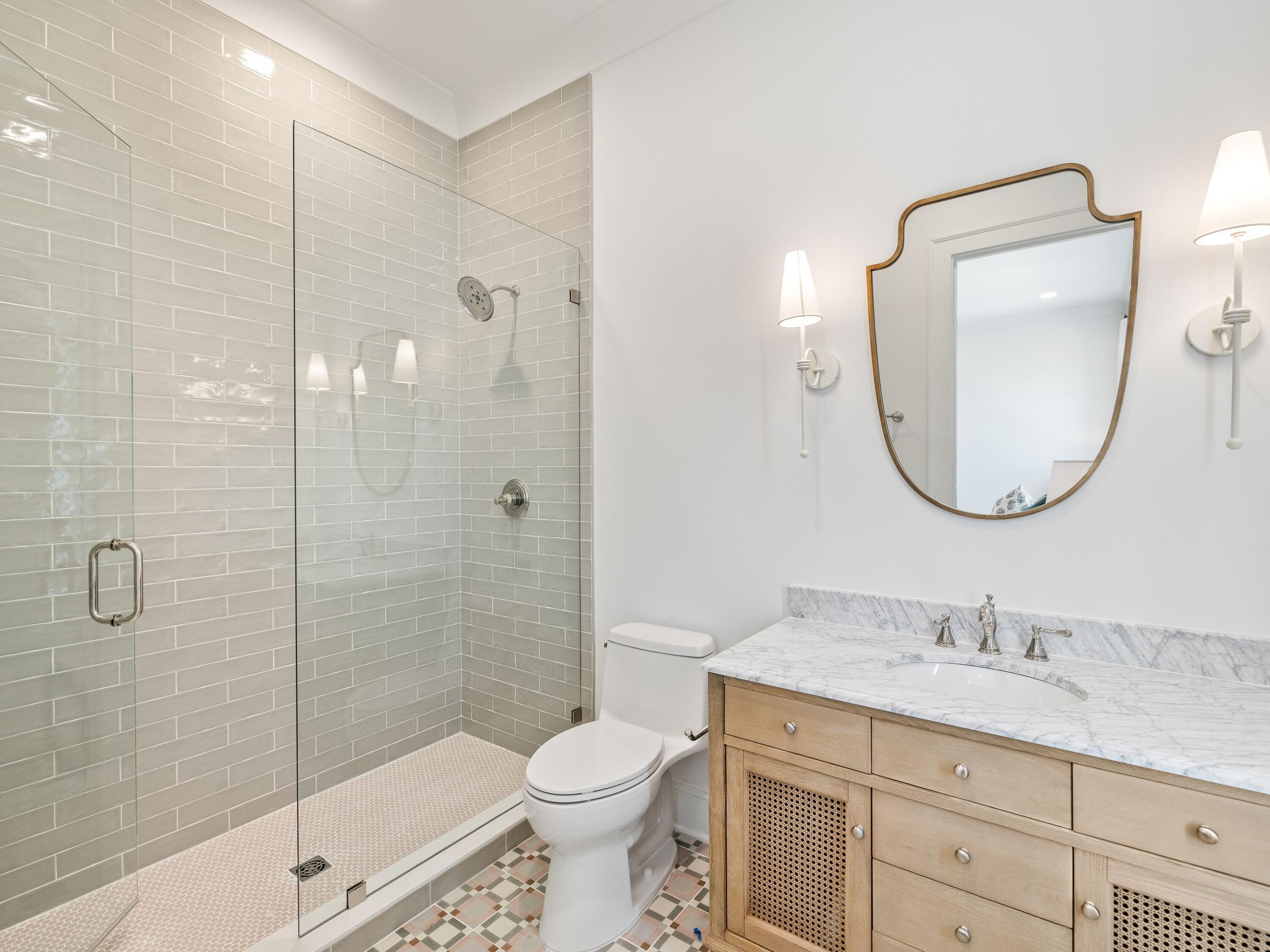 41 Marthas Lane Santa Rosa Beach, FL 32459 - Photo 94 of 101 a bathroom with a granite countertop toilet a sink and a mirror