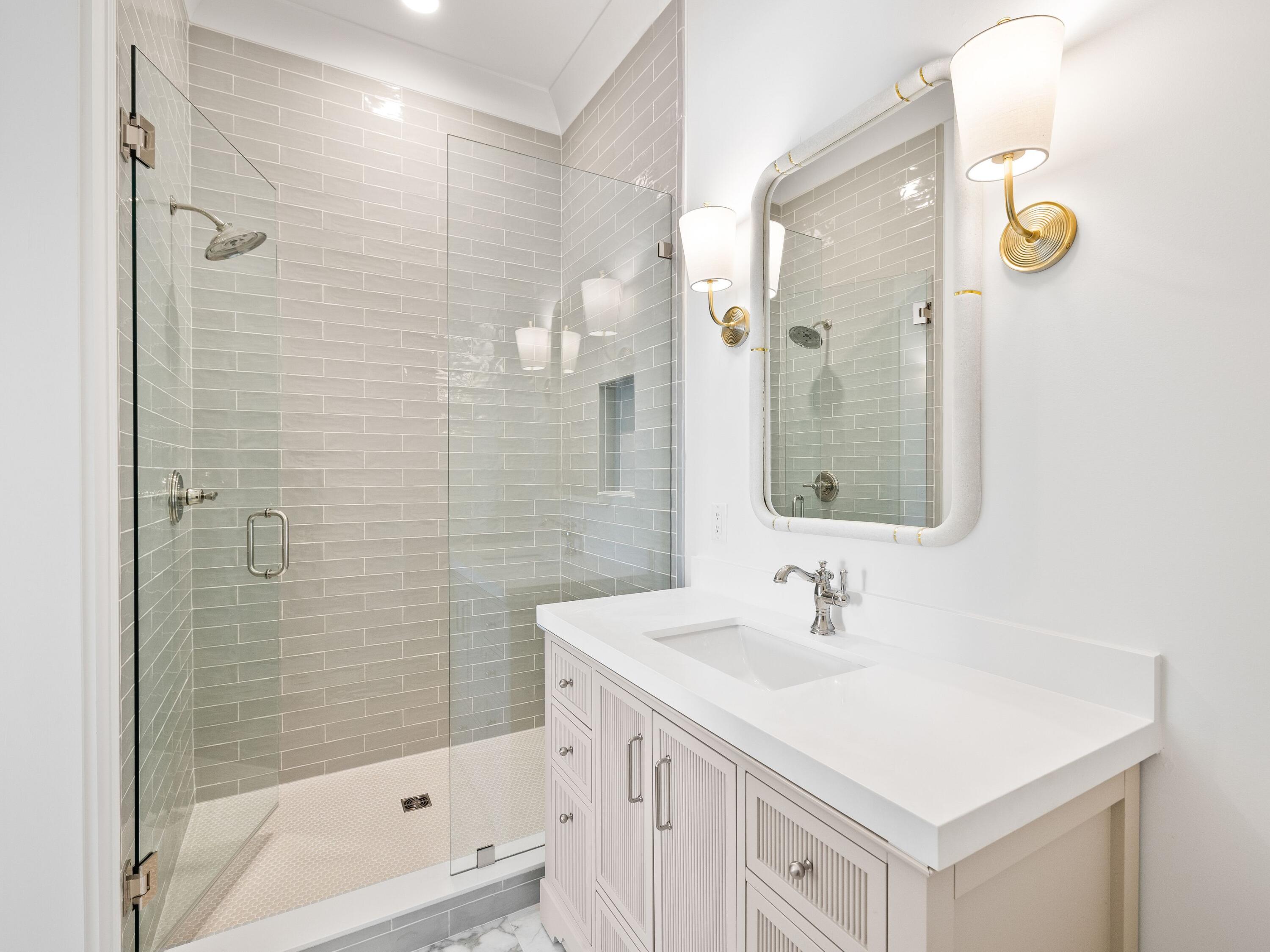 41 Marthas Lane Santa Rosa Beach, FL 32459 - Photo 97 of 101 a bathroom with a sink a mirror a shower and a bathtub