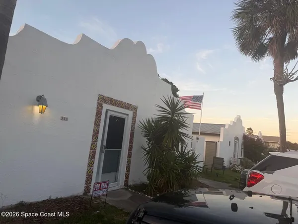 a view of a house with a street