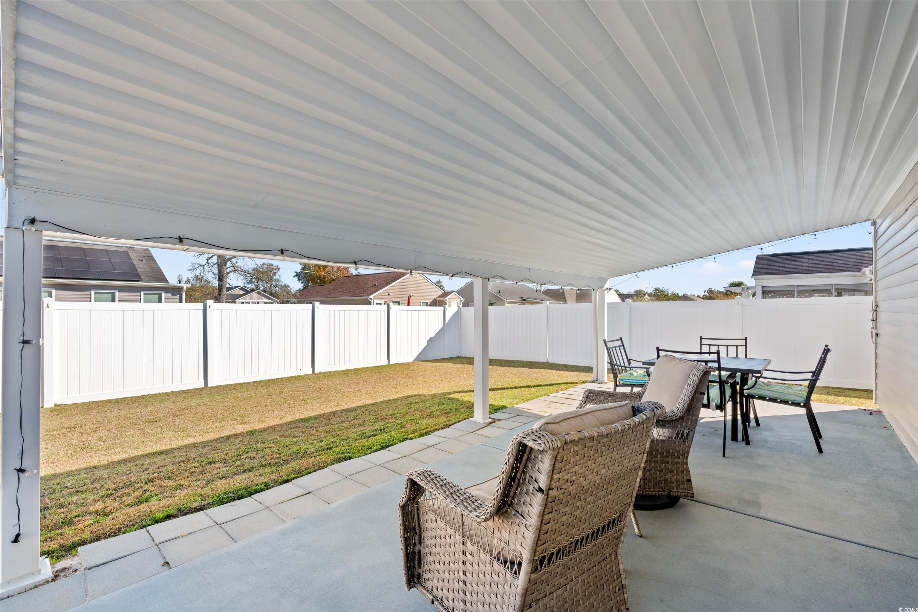 1349 Boker Road Conway, SC 29527 - Photo 18 of 21 Fenced backyard featuring a patio and outdoor dining area