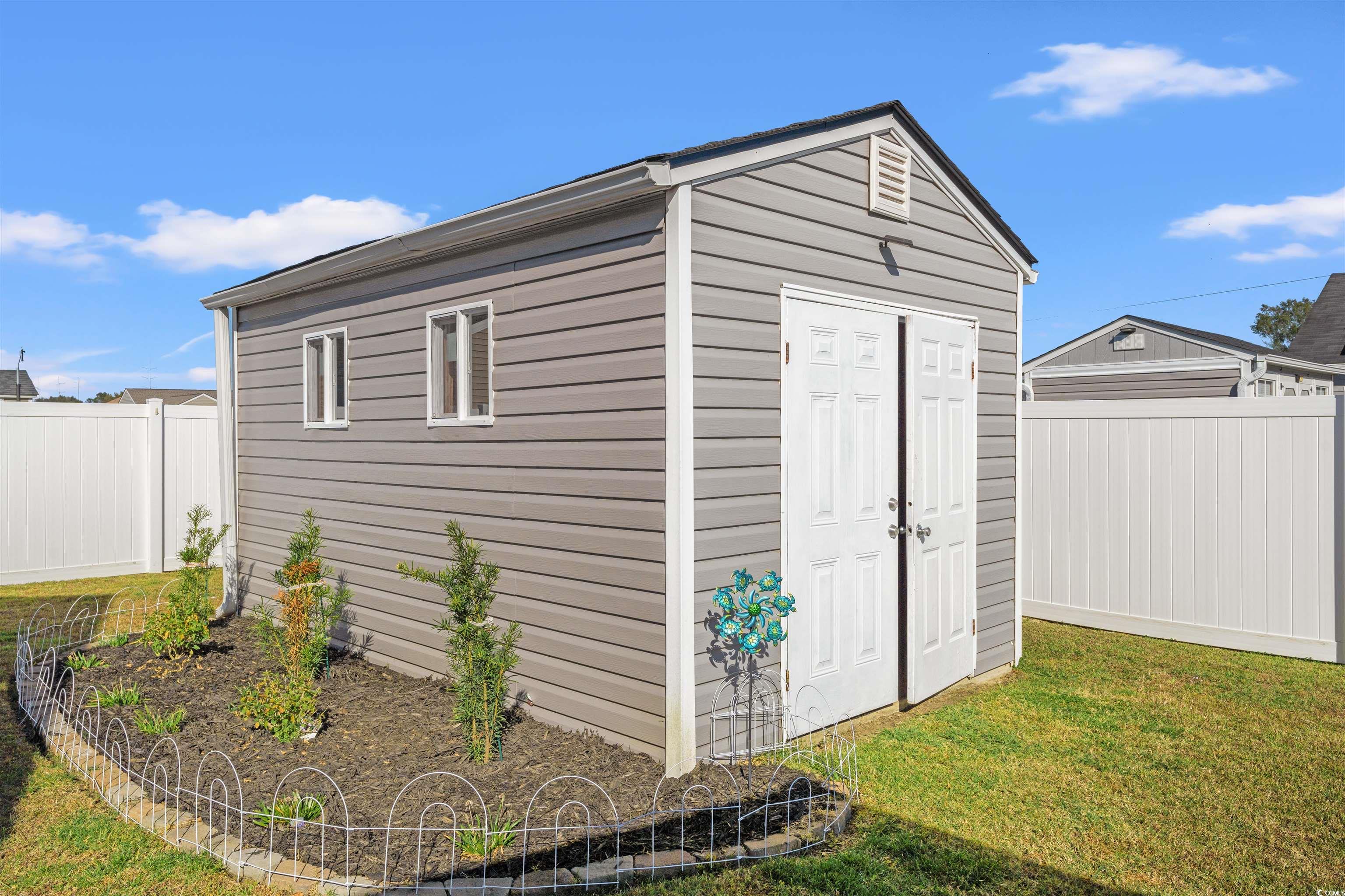 1349 Boker Road Conway, SC 29527 - Photo 20 of 21 View of shed featuring a fenced backyard