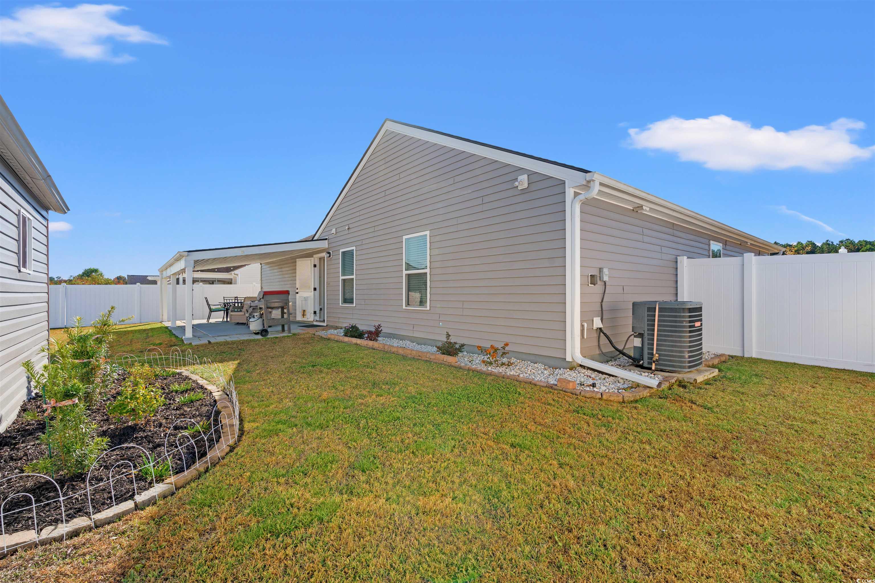 1349 Boker Road Conway, SC 29527 - Photo 21 of 21 Rear view of house featuring a fenced backyard and a patio