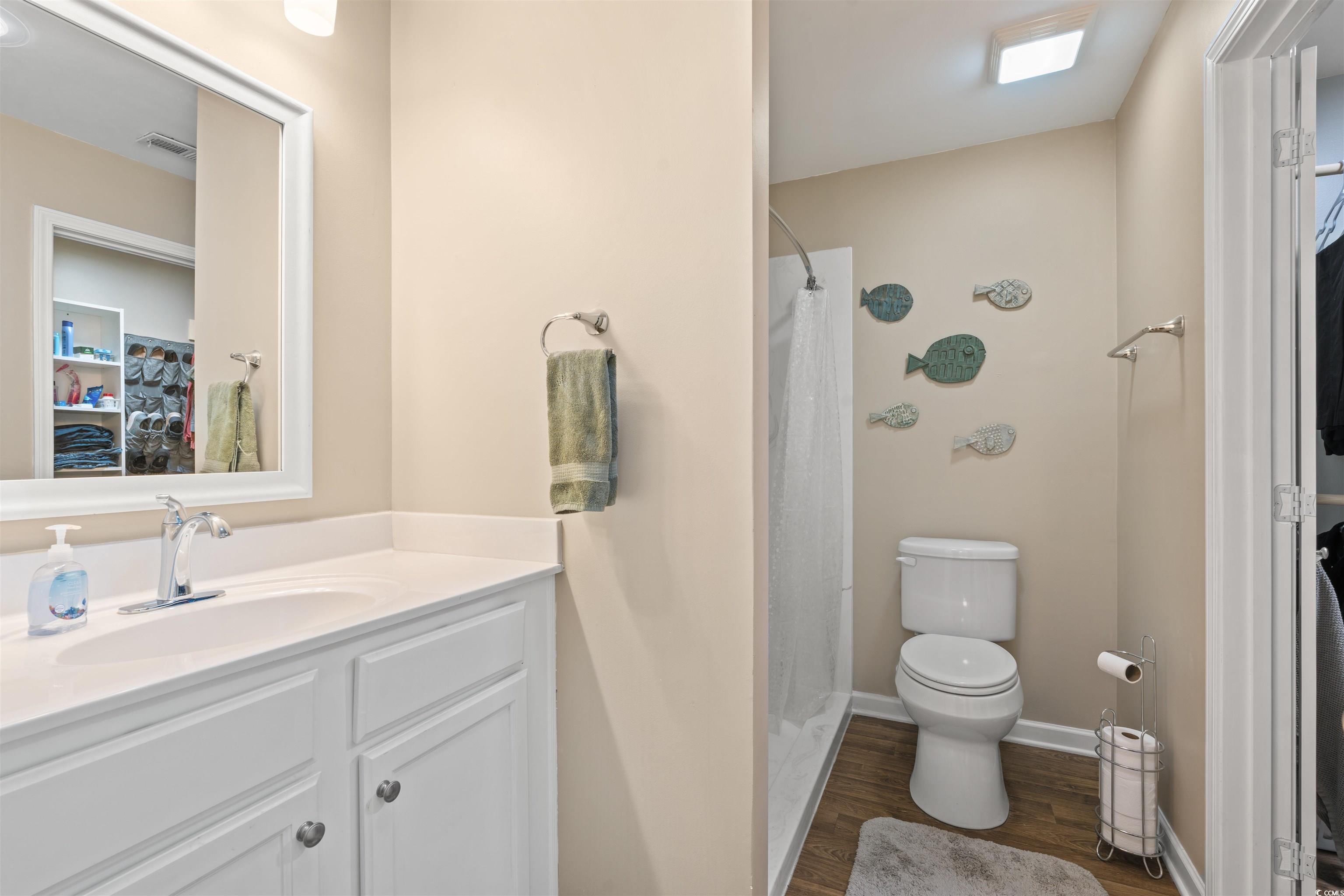 1349 Boker Road Conway, SC 29527 - Photo 9 of 21 Full bath with a spacious closet, a shower with shower curtain, vanity, and dark wood-style floors