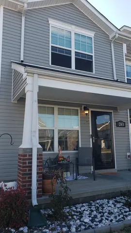 a front view of a house with a porch