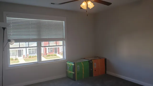 an empty room with wooden floor