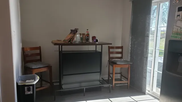 a room with a chair and a mirror