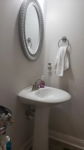 a bathroom with a sink and a mirror