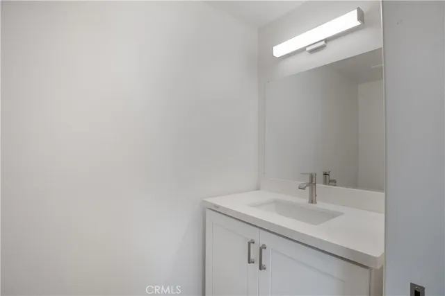 a bathroom with a sink and mirror