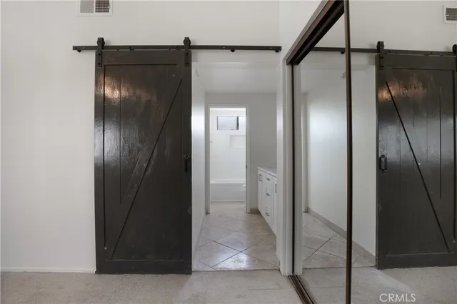 a bathroom with a toilet and a bathtub