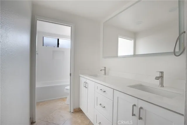 an empty room with windows and entrance