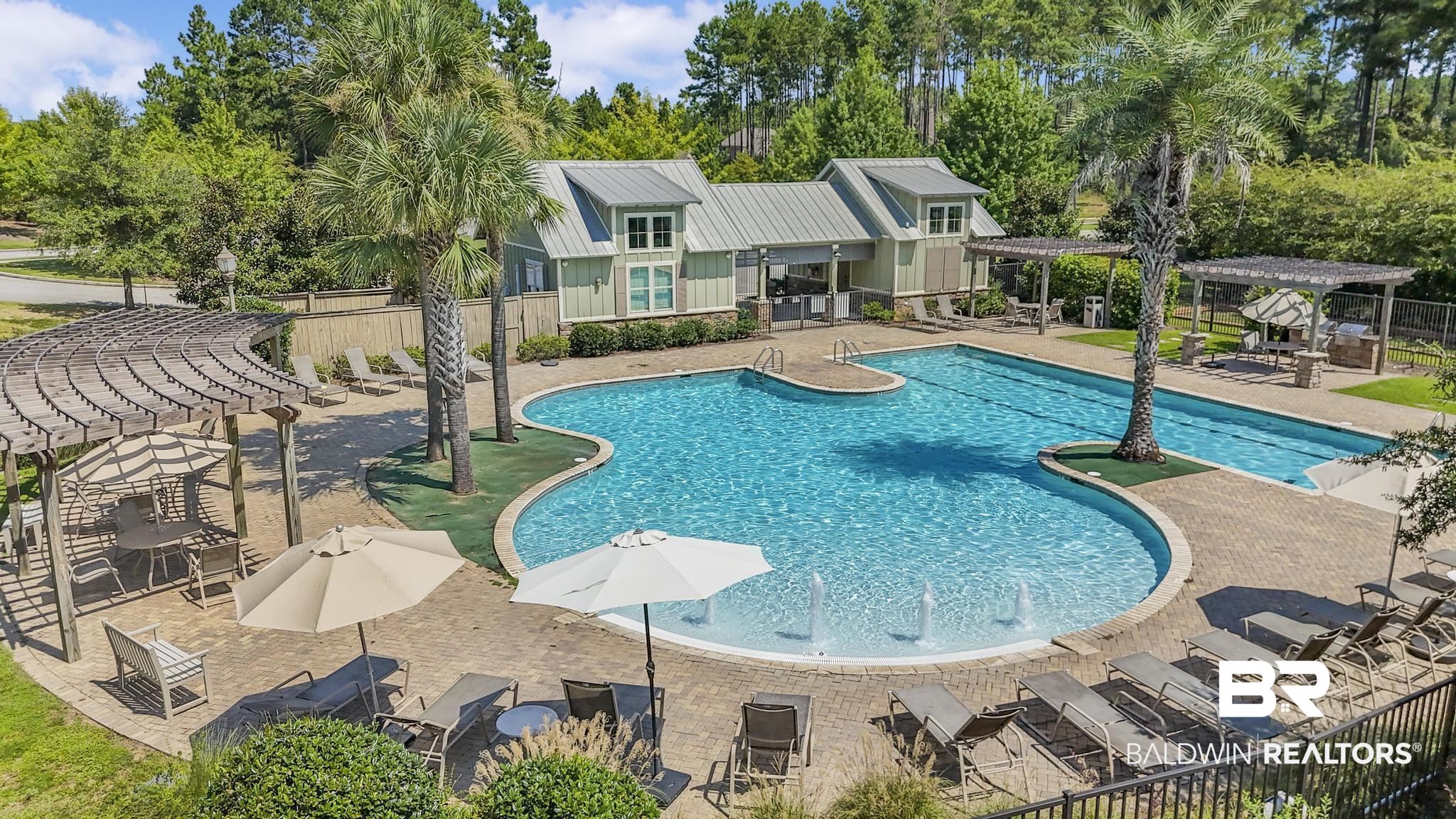31336 Hoot Owl Road Daphne, AL 36527 - Photo 34 of 36 Community pool with a pergola, a patio, and view of scattered trees