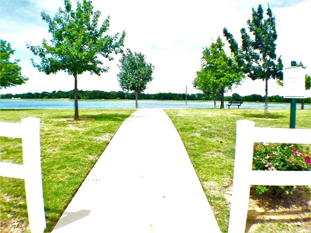 a view of a swimming pool with a garden