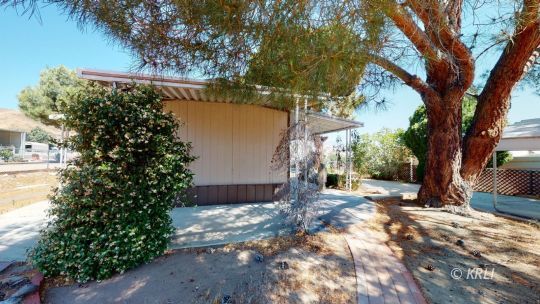 3816 Goat Ranch Road Mountain Mesa, CA 93240 - Photo 20 of 20 a backyard of a house with lots of green space