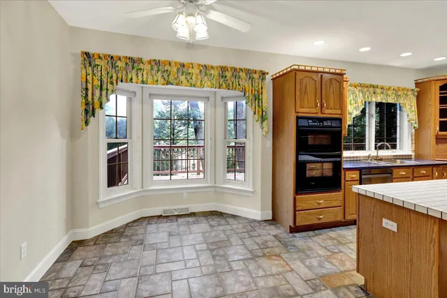 a kitchen with a sink stove and refrigerator