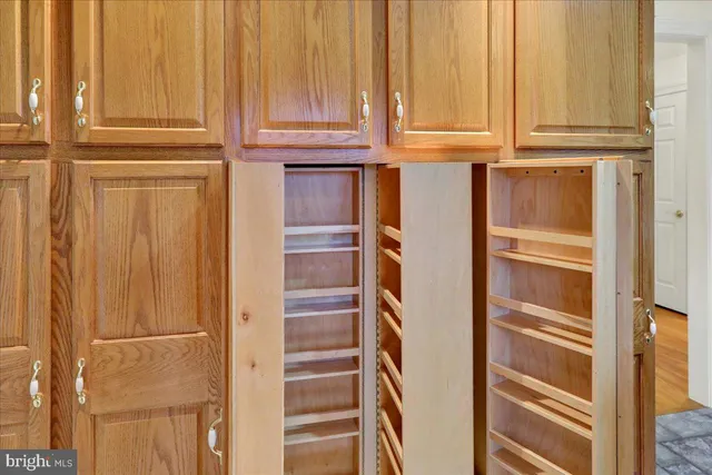 a living room with a fireplace and a rug
