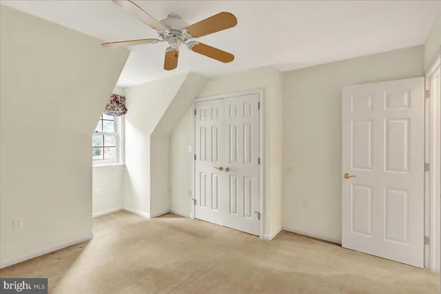 wooden floor in a hall with a window