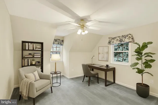 a bedroom with a large bed and a tv