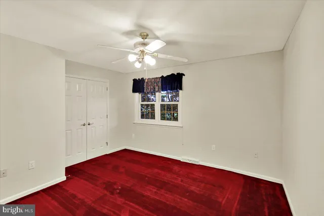 a bedroom with bed and a flat screen tv