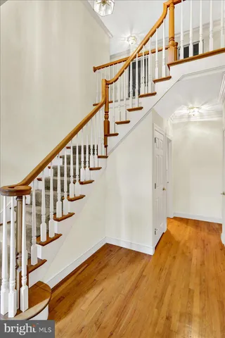a view of an entryway with wooden floor