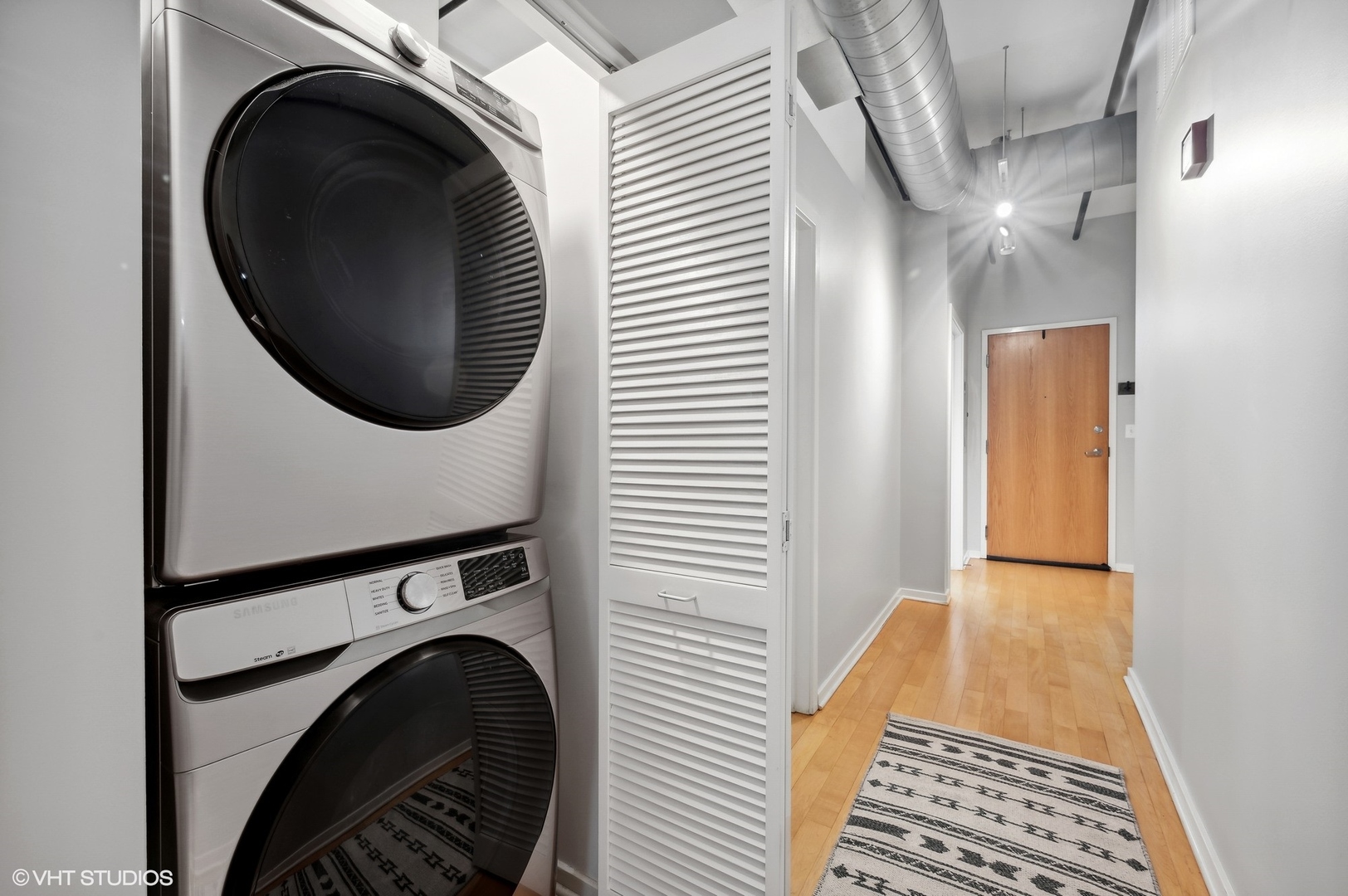 520 South State Street, Unit 908 Chicago, IL 60605 - Photo 13 of 16 a view of a hallway with washer and dryer