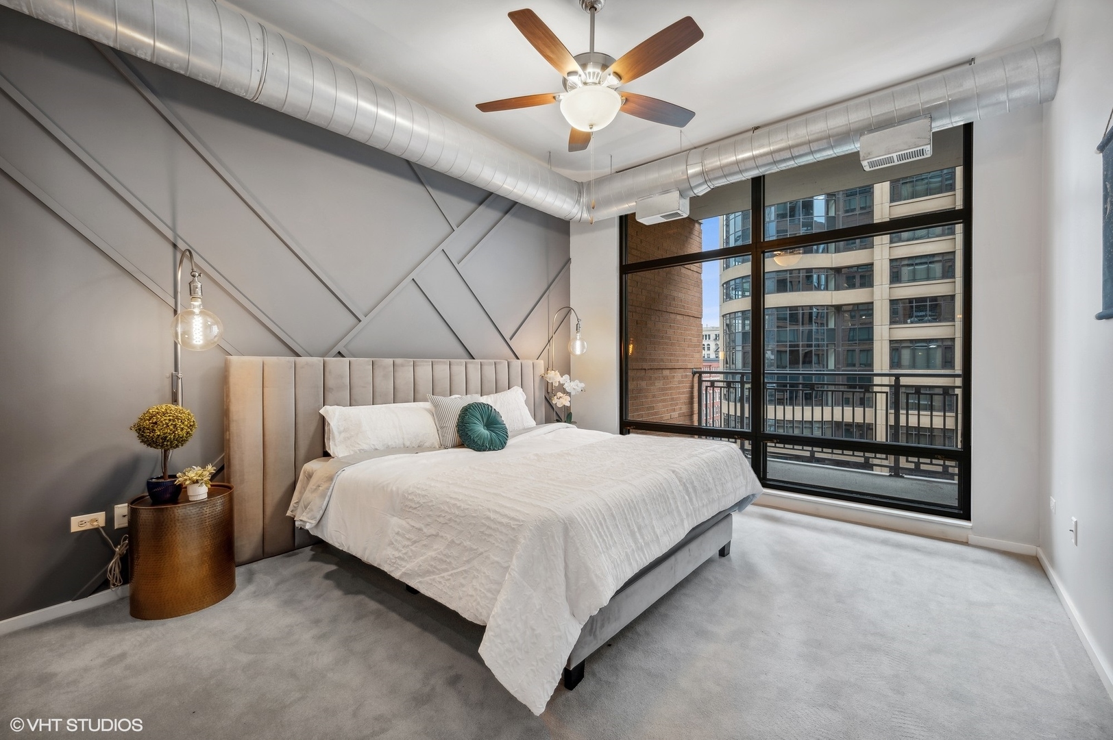 520 South State Street, Unit 908 Chicago, IL 60605 - Photo 7 of 16 a bedroom with a bed and a chandelier