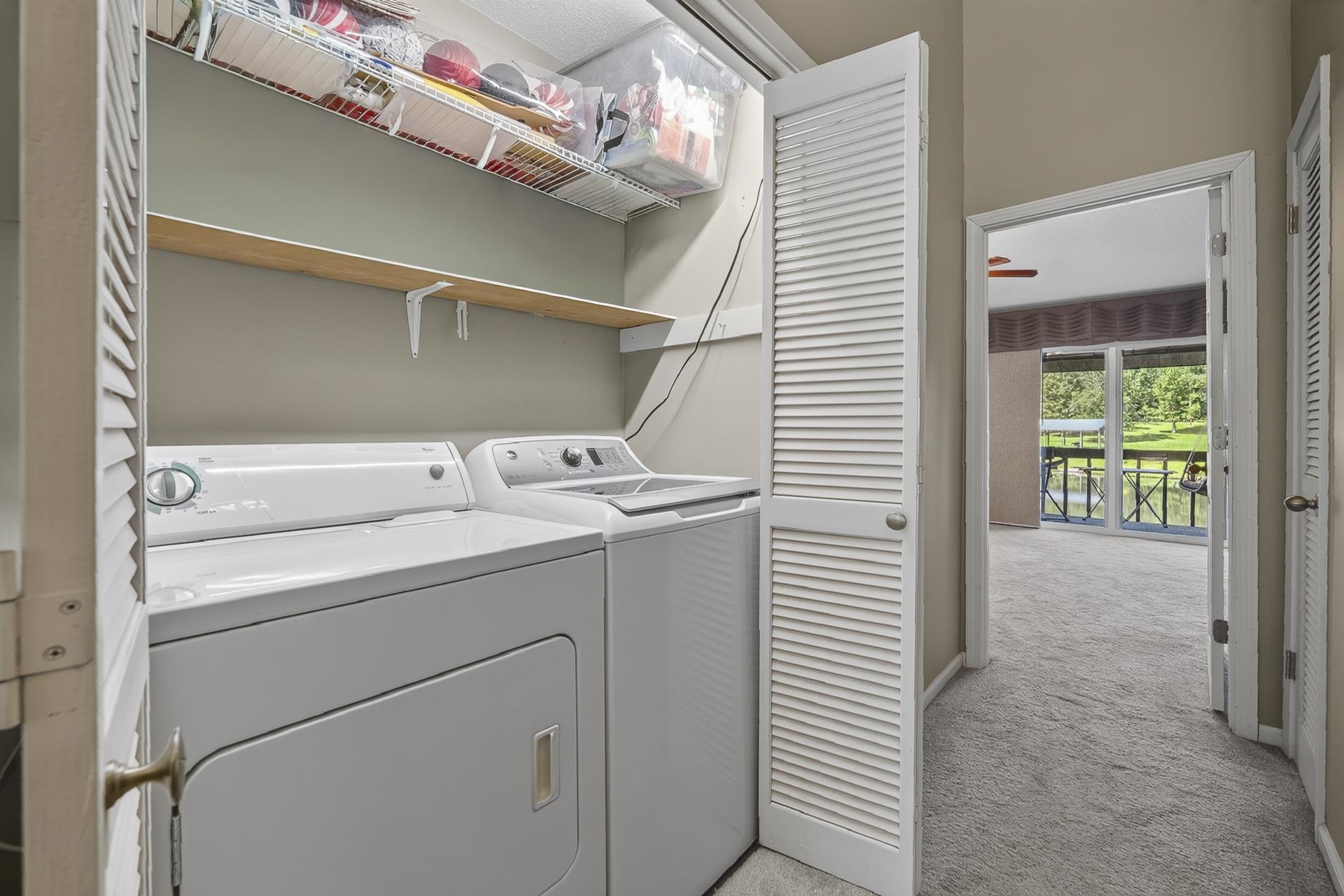 74 Driftwood Road Counce, TN 38326 - Photo 19 of 40 Dedicated laundry closet with white louvered bifold doors to Level 2 hallway
