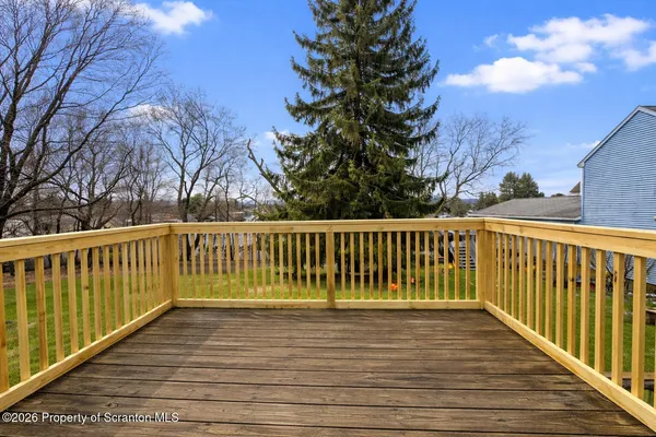 a view of a wooden roof deck