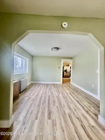 a view of an empty room and window