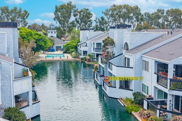 a aerial view of a house with swimming pool and a yard