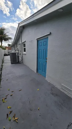 a view of house with backyard