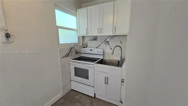 a view of cabinets and sink