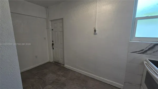 an empty room with a door