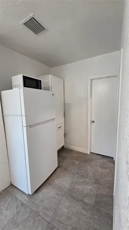 a view of a storage & utility room with washer and dryer