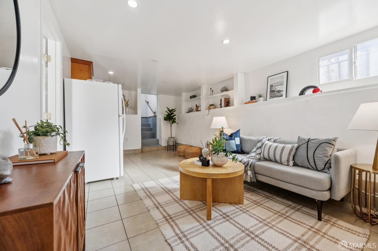 180 Ocean Avenue San Francisco, CA 94112 - Photo 45 of 62 a living room with furniture and a potted plant