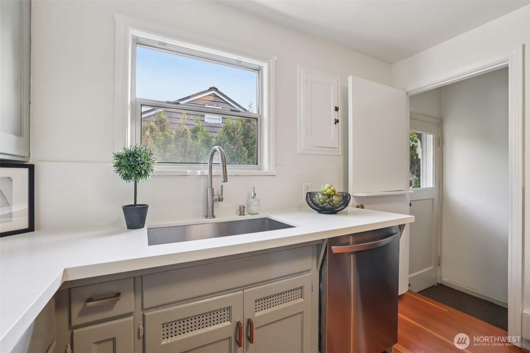 819 Northwest 80th Street Seattle, WA 98117 - Photo 13 of 37 a bathroom with a sink and a mirror