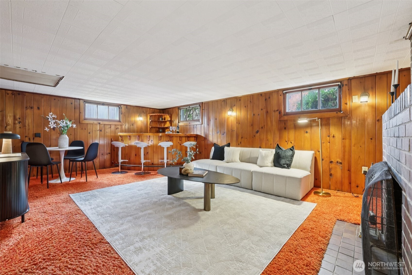 819 Northwest 80th Street Seattle, WA 98117 - Photo 22 of 37 a living room with lots of furniture and a rug