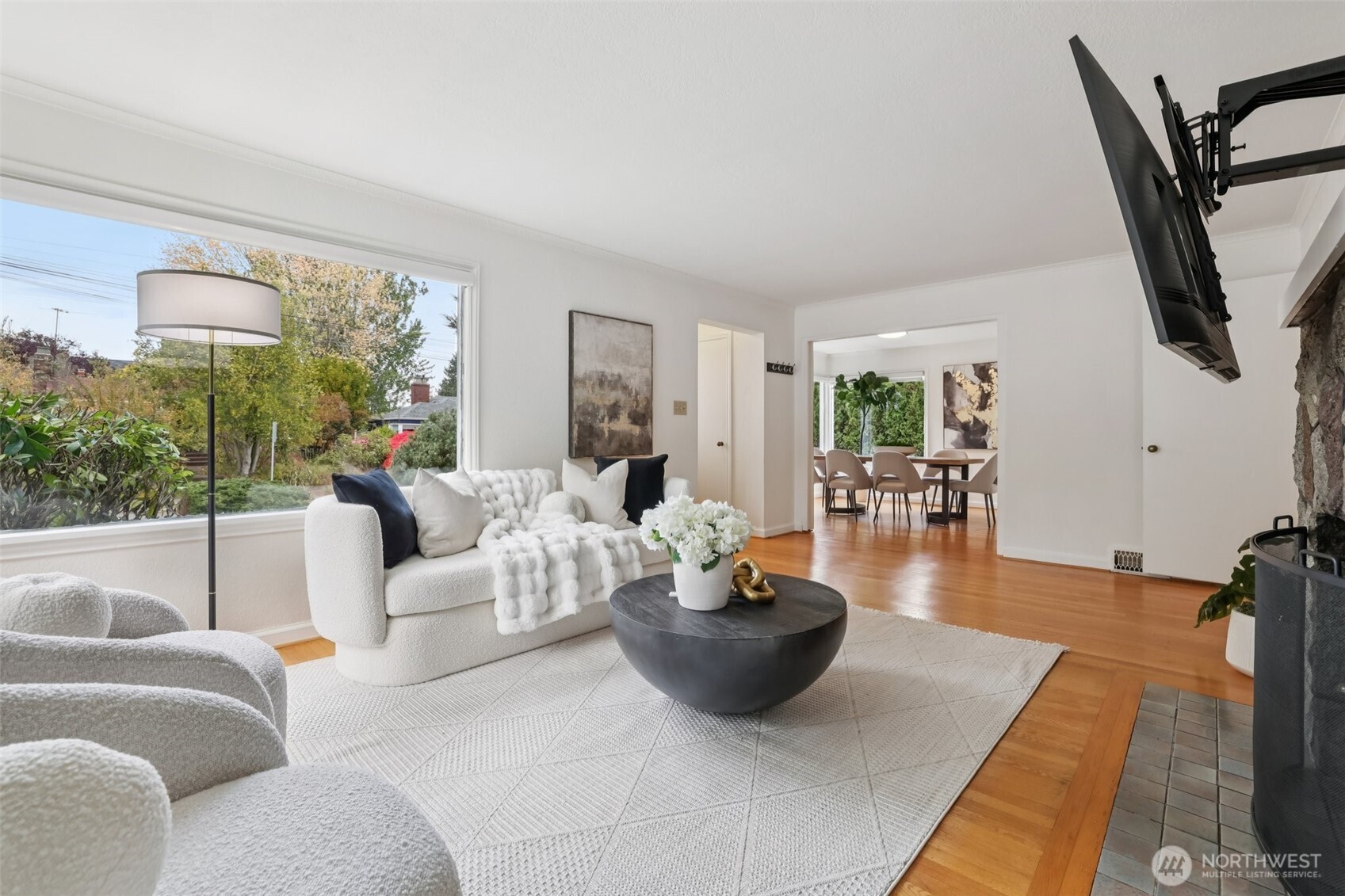 819 Northwest 80th Street Seattle, WA 98117 - Photo 5 of 37 a living room with furniture a rug and a floor to ceiling window