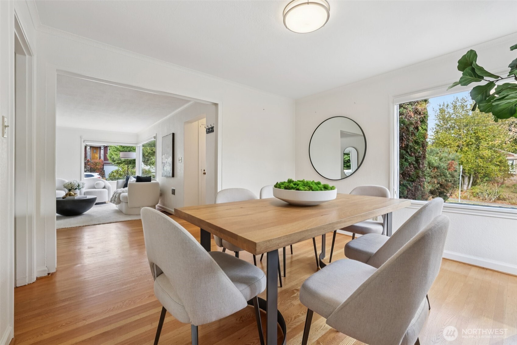 819 Northwest 80th Street Seattle, WA 98117 - Photo 9 of 37 a living room with furniture a window and a potted plant