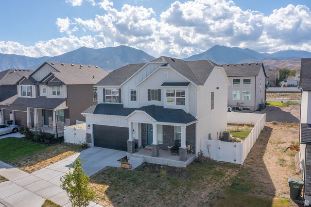 373 Quartz Road Tooele, UT 84074 - Photo 2 of 38 Modern Colonial-style residence featuring white siding and dark gray roofing