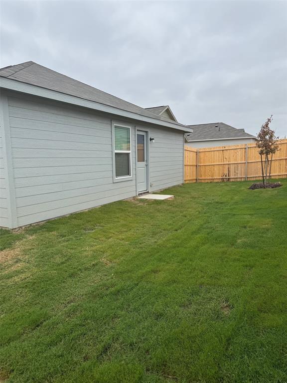 11719 Bone Spg Drive Rhome, TX 76078 - Photo 11 of 18 a house view with a garden space