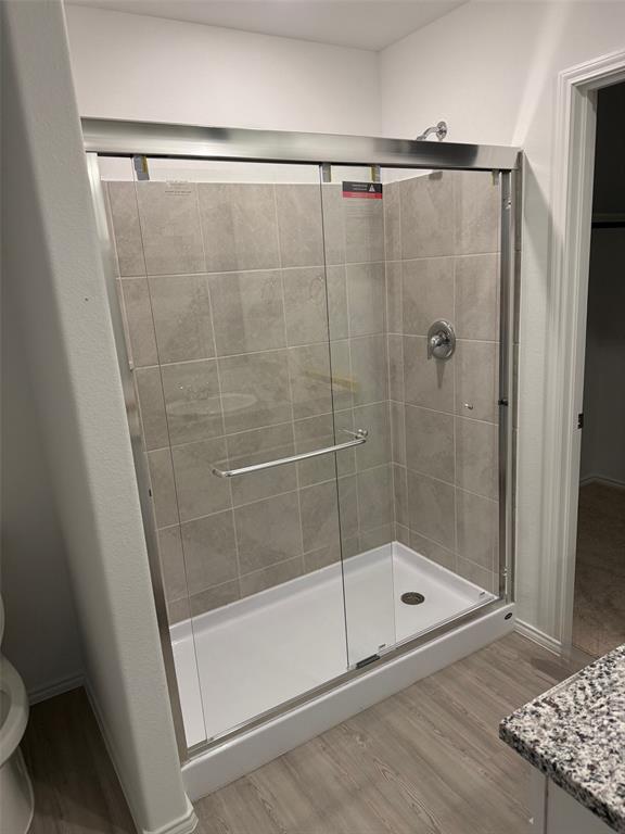 11719 Bone Spg Drive Rhome, TX 76078 - Photo 12 of 18 a bathroom with a shower