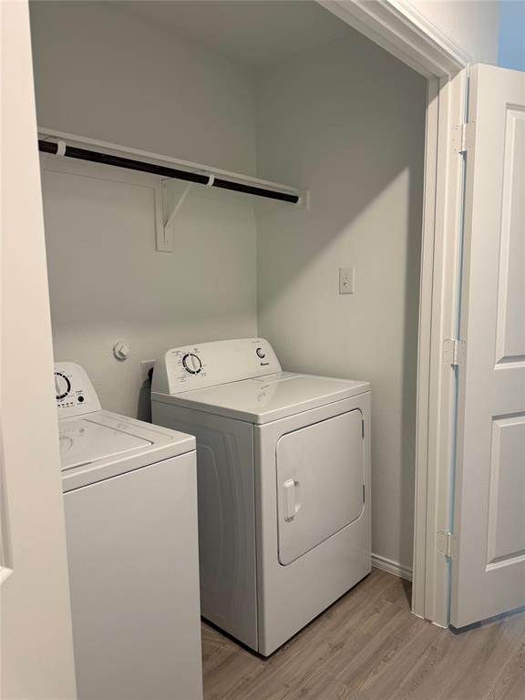 11719 Bone Spg Drive Rhome, TX 76078 - Photo 17 of 18 a utility room with dryer and washer